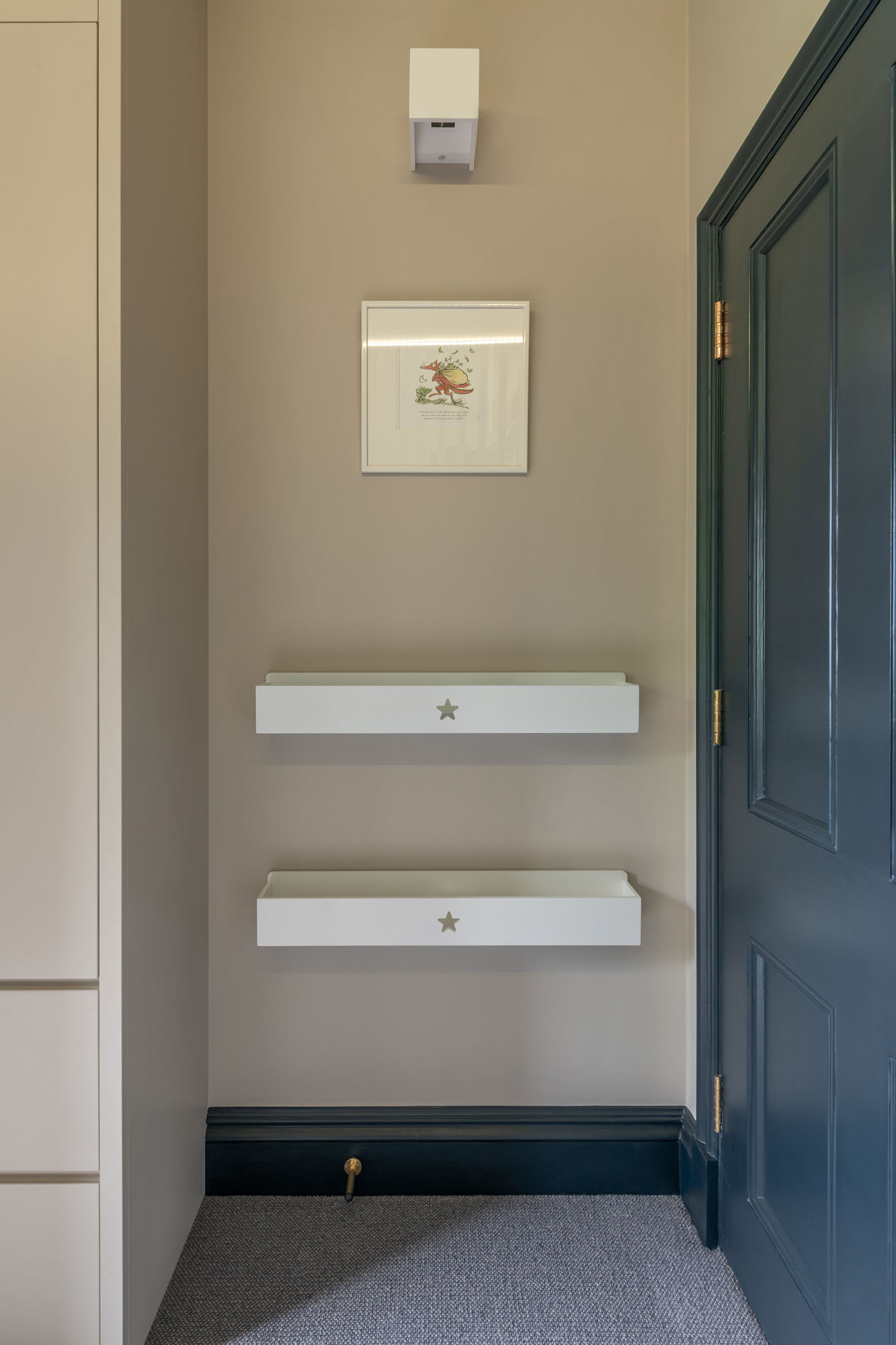 Hampstead boy’s bedroom by Funky Little Darlings, featuring Fantastic Mr Fox wall art by Roald Dahl paired with wall-mounted white book shelves, creating a playful and literary-themed reading space for children.