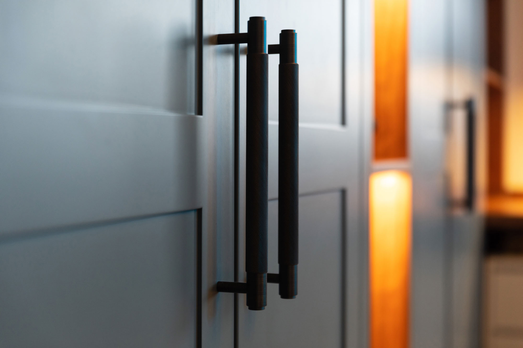 Contemporary Hampstead boy’s bedroom by Funky Little Darlings featuring bespoke built-in wardrobes with luxury Buster and Punch handles, combining stylish design and functional storage solutions.