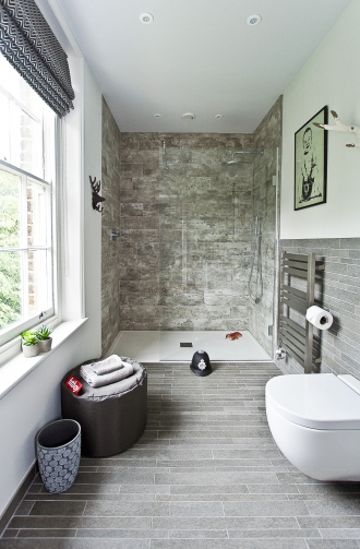 Boy's bathroom with Banksy picture