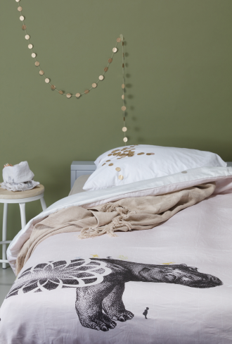 girls bed linen in green room