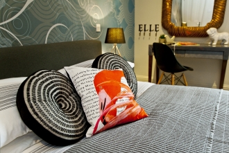 Bedroom with funky cushions, girls bedroom