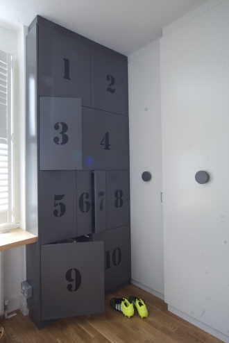 Grey wardrobes, storage in boy's bedroom